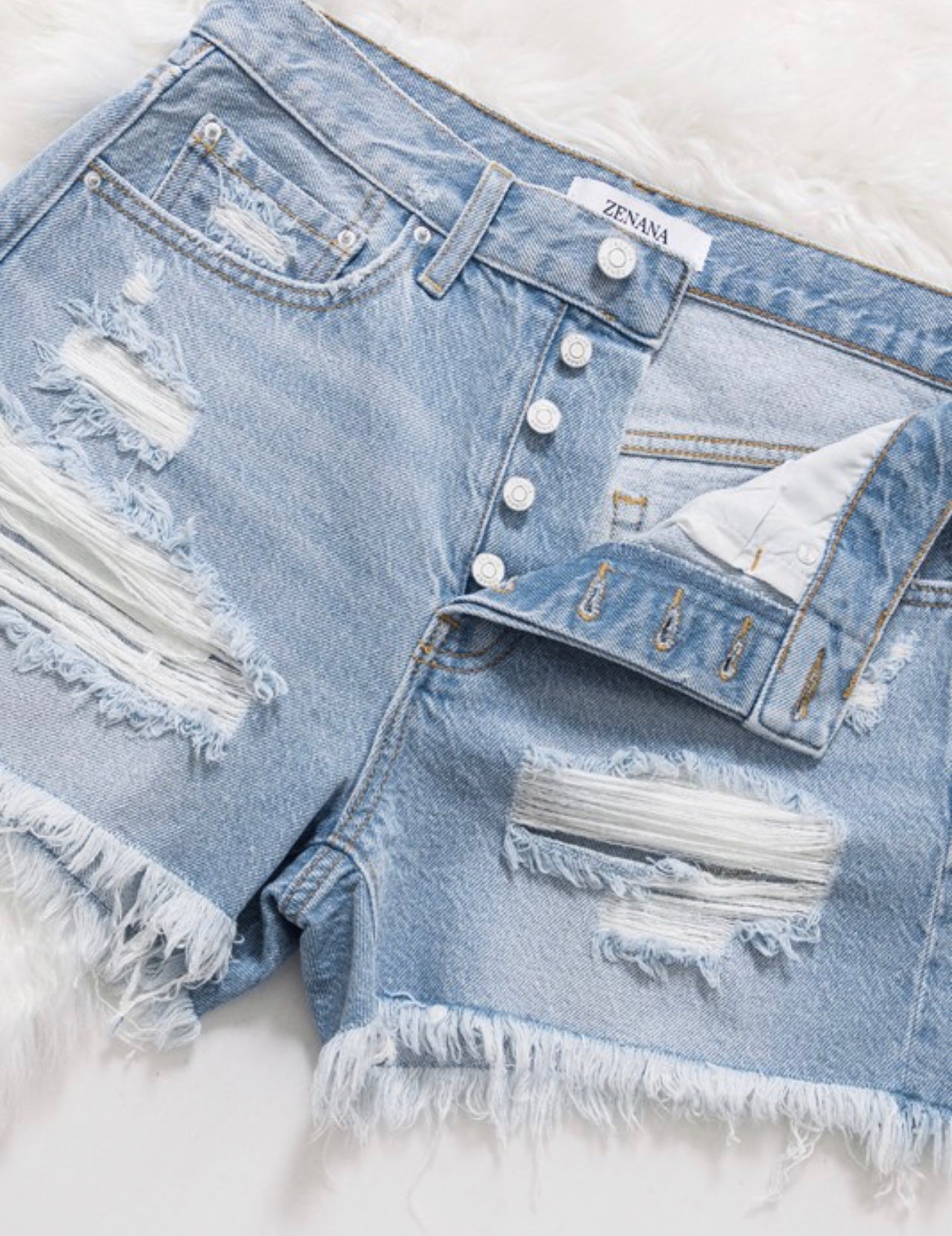 Vivi ~ Lite Wash distressed denim shorts